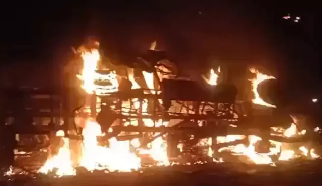 12 charred to death as bus catches fire after collision with dumper