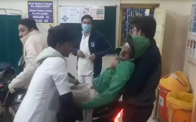 Scene from movie Three Idiots seen in the hospital as man takes patient to emergency ward on bike