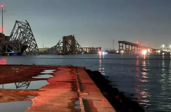 Heavy bridge built on river collapses due to ship collision in America