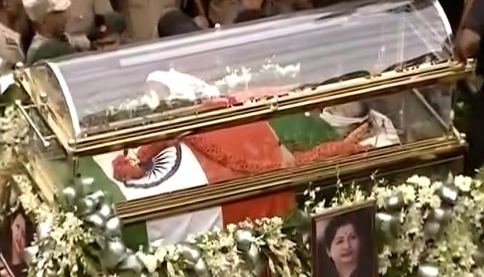 Jayalalithaa buried with full state honours at Marina Beach