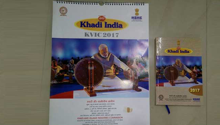 PM Modi replaces Mahatma Gandhi at charkha on KVIC calendar