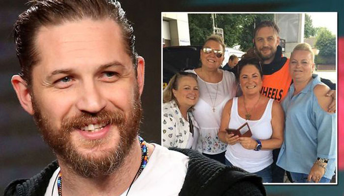 Actor Tom Hardy poses for selfies at petrol station