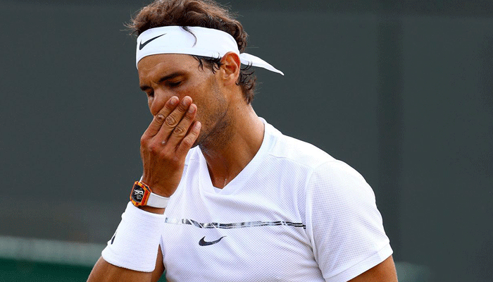 Wimbledon: Rafael Nadal knocked out by Gilles Muller in five-set epic
