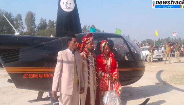 Wow! farmer’s son carries bride from helicopter