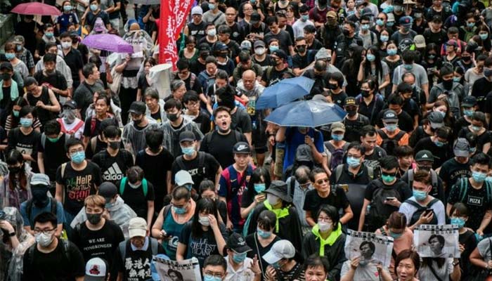Flouting ban, Hong Kong protesters flood city streets