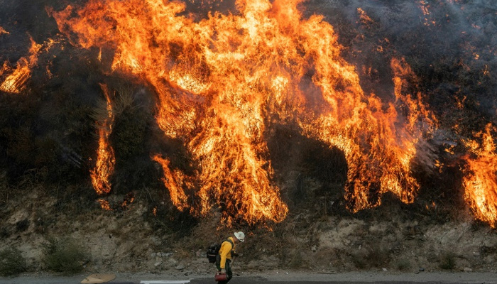 Tens of thousands evacuated as California wildfires rage