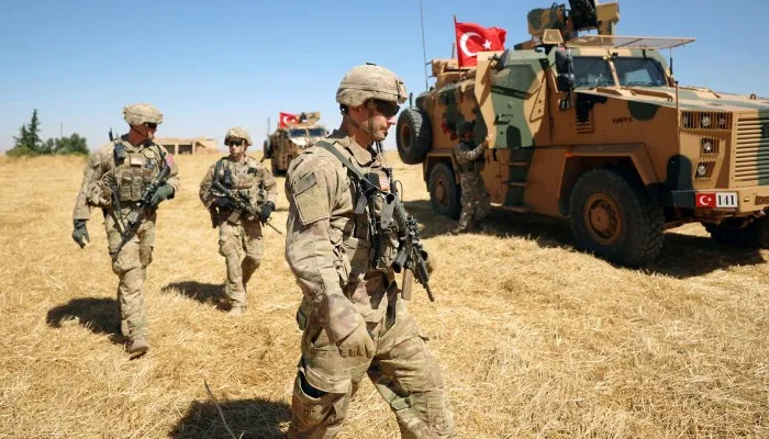 Turkey vows to keep up Syria assault as US says troops came under fire