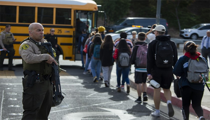 Gunman in US school shooting dies as police hunt motive