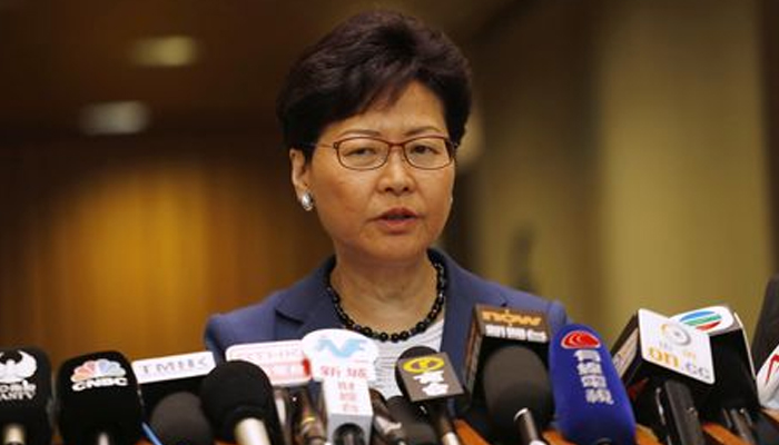 Hong Kong leader says new US law, violence will harm economy