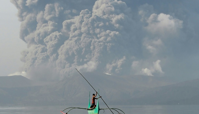 Philippines on alert as erupting volcano spews ash, lava